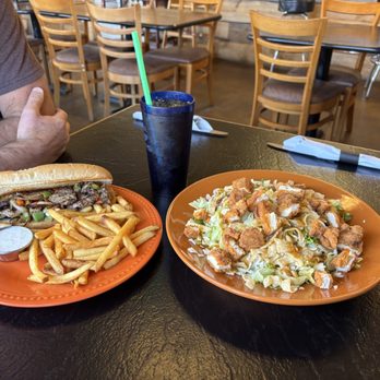 The Saddle Rack Bar & Grill - Philly with fries, and a sesame chicken salad - Barbeque Near Me - Cambridge, Idaho The Saddle Rack Bar & Grill - Philly with fries, and a sesame chicken salad - Barbeque Near Me - Cambridge, Idaho