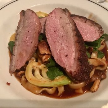 Place Pigalle - Duck Breast over pan new noodles, choy sum, mushrooms, coriander, and soy-ginger ponzu - French Near Me - Seattle, Washington