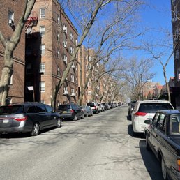 a street lined with parked cars a street lined with parked cars