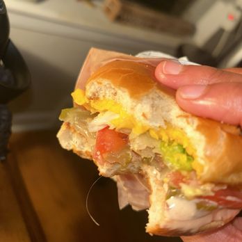 In-N-Out Burger - ows a hand holding a half eaten sandwich - Burgers Near Me - Denton, Texas In-N-Out Burger - ows a hand holding a half eaten sandwich - Burgers Near Me - Denton, Texas