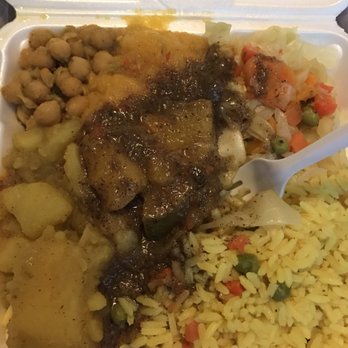 Ali's Roti Restaurant - Veggie plate with chickpeas, yellow rice, potatoes, mango, and cabbage. - Trinidadian Near Me - Mattapan, Massachusetts