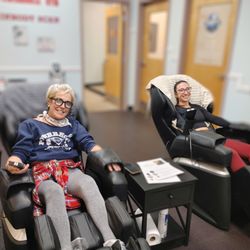 Powerhouse Gym - Relaxing in Massage Chairs