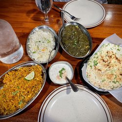 Red Fort Cuisine of India - L to R-Chicken Briyani, rice, Chicken Saag, Garlic Naan (G)(V), Cucumber Raita (V)