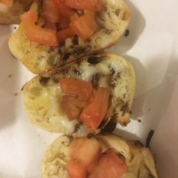 'Fresh mozzarella, sautéed grape tomatoes, and balsamic reductionatop toasted baguettes' - what the menu said :-)
