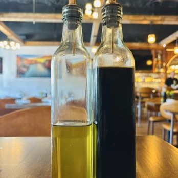 Fratello’s Italian Tavern - I like the place already Olive oil and balsamic vinegar on the table ready to go - Italian Near Me - Charleston, South Carolina Fratello’s Italian Tavern - I like the place already Olive oil and balsamic vinegar on the table ready to go - Italian Near Me - Charleston, South Carolina