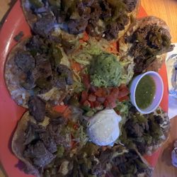 Ojos Locos Sports Cantina - The regular fajita or chicken nachos they have are good. But this steak nachos was nasty, didn't taste fresh. Will not get them again