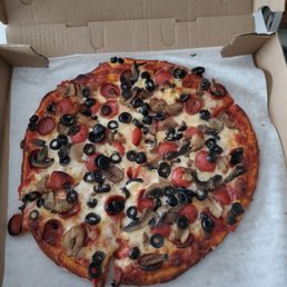 Small pizza with pepperoni mushrooms and black olives