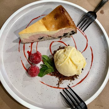 Cajun Boil - a slice of cheesecake with ice cream and raspberries - Cajun/Creole Near Me - Plantation, Florida
