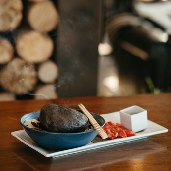 The Firebrand Hotel - Cook at your table with this Hot Rock dining experience and choice of Wagyu Beef or Scallops. - Hotels Near Me - Whitefish, Montana The Firebrand Hotel - Cook at your table with this Hot Rock dining experience and choice of Wagyu Beef or Scallops. - Hotels Near Me - Whitefish, Montana