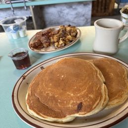 Coffee, Chocolate chip pancakes, bacon and home fries