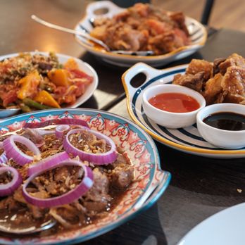 Kusinera - Bistek Tagalog (Front), Ginisang Ampalaya (Left), Lechon Kawali (Right), Chicken Afritada (Back) - Filipino Near Me - East Meadow, New York Kusinera - Bistek Tagalog (Front), Ginisang Ampalaya (Left), Lechon Kawali (Right), Chicken Afritada (Back) - Filipino Near Me - East Meadow, New York