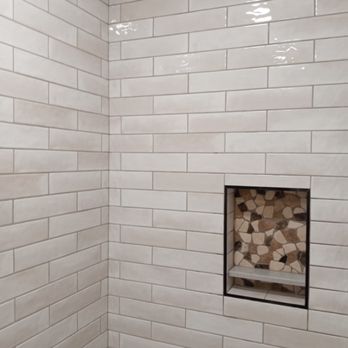 Craftsman Tile Techs - a white tiled shower - General Contractors Near Me