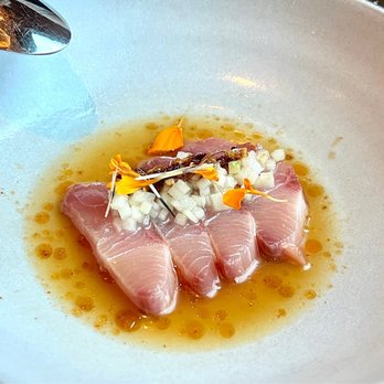Goldfinch Tavern - Hamachi Crudo is topped with apple, little kick of smoky calabrian chili crisp, sweet apple ponzu vinaigrette (hint of Indian flavor.) - Seafood Near Me - Seattle, Washington Goldfinch Tavern - Hamachi Crudo is topped with apple, little kick of smoky calabrian chili crisp, sweet apple ponzu vinaigrette (hint of Indian flavor.) - Seafood Near Me - Seattle, Washington