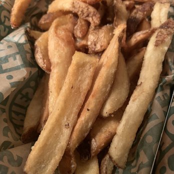 Wingstop - a basket of french fries on a table - Chicken Wings Near Me - Clovis, New Mexico