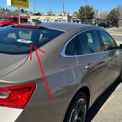 Hertz Rent A Car - Lyft sticker left on car that wasn't properly cleaned