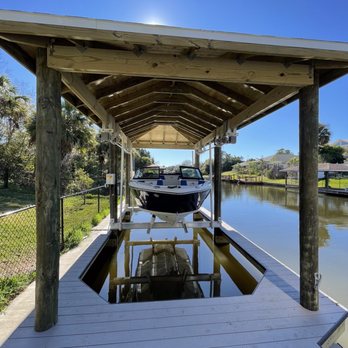 New Wave Marine - Dock with boat lift and jet ski lifts - General Contractors Near Me