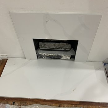 Smart Construction Consultants - a tv in a recessed fireplace - General Contractors Near Me - Encino, California Smart Construction Consultants - a tv in a recessed fireplace - General Contractors Near Me - Encino, California