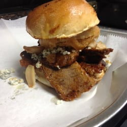 Stack House - Our Blue Ridge Brisket sandwich. Our slow cooked brisket drenched in our Beer-B-Q sauce with bleu cheese, roasted garlic and an onion ring