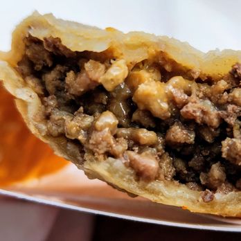 Mi Patria - Two bites into the flavorful Carne Empanadilla (7/24/24) - Caterers Near Me - Seattle, Washington