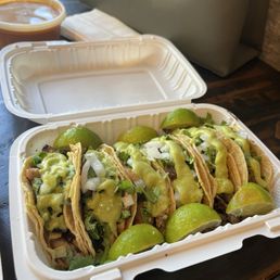 Chicken and carne asada tacos with everything on it. Green avocado sauce, unions, and cilantro. Chicken and carne asada tacos with everything on it. Green avocado sauce, unions, and cilantro.