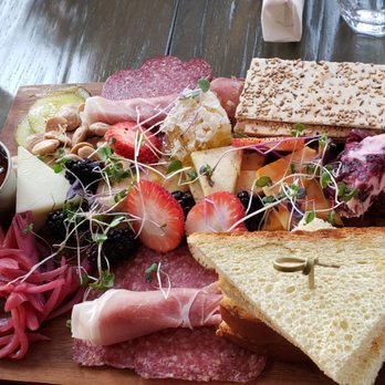 NWB Next Whiskey Bar Plainfield - House charcuterie board ($23): assorted meats, cheeses, apricot jam, honeycomb, almonds, and pickled onions - American Near Me - Plainfield, Illinois NWB Next Whiskey Bar Plainfield - House charcuterie board ($23): assorted meats, cheeses, apricot jam, honeycomb, almonds, and pickled onions - American Near Me - Plainfield, Illinois