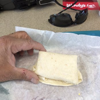 Wendy's - a person's hand holding a burrito - Fast Food Near Me - Cave Creek, Arizona