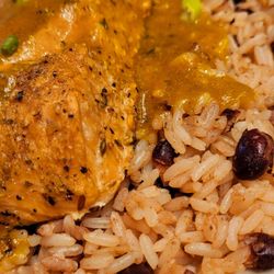 Curry n Jerk - Curry salmon over rice and peas delicious