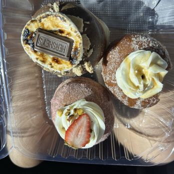 Doughtastic Donuts - Banana French toast on right Left is the s'mores and bottom is strawberry pistachio!! - Desserts Near Me - Riverside, California