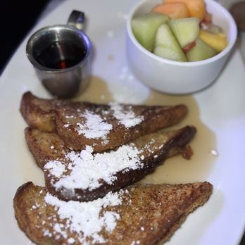 Society - French toast with a side of fruit - New American Near Me - Kansas City, Missouri Society - French toast with a side of fruit - New American Near Me - Kansas City, Missouri