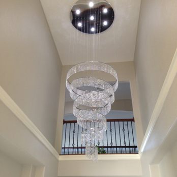 Four Points Home Services - Installation of heavy crystal chandelier on 18 foot ceiling - Handyman Near Me