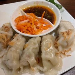 Chicken dumplings with dipping sauce. Chicken dumplings with dipping sauce.
