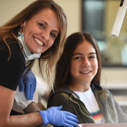 Freeman Orthodontics - Our RDA, Regina and a patient.