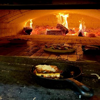 Brick & Fire Bistro - Lasagna in foreground. - Mediterranean Near Me - Eureka, California Brick & Fire Bistro - Lasagna in foreground. - Mediterranean Near Me - Eureka, California