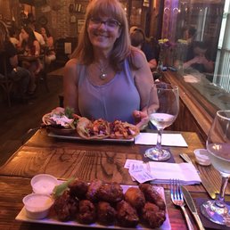 Eating a delicious meal in an upbeat, friendly ,casual atmosphere. Get the double fried chicken wings! Eating a delicious meal in an upbeat, friendly ,casual atmosphere. Get the double fried chicken wings!