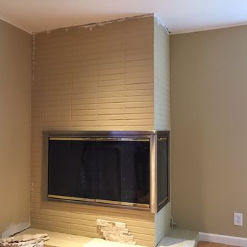 Alex's Custom Tile - Existing fireplace facade, made beautiful by Alex's Custom Tile! - General Contractors Near Me