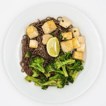 Prepped for Days - a plate of noodles with tofu and broccoli - Food Delivery Services Near Me Prepped for Days - a plate of noodles with tofu and broccoli - Food Delivery Services Near Me