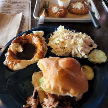 Dinosaur Bar-B-Que - Pulled pork sandwich with mashed potatoes & gravy and coleslaw - Barbeque Near Me - Rochester, New York Dinosaur Bar-B-Que - Pulled pork sandwich with mashed potatoes & gravy and coleslaw - Barbeque Near Me - Rochester, New York