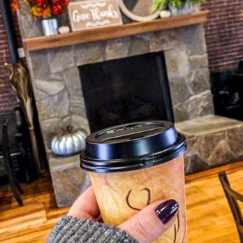 Bonhoeffer's Cafe & Espresso - a hand holding a coffee cup - Coffee & Tea Near Me - Nashua, New Hampshire