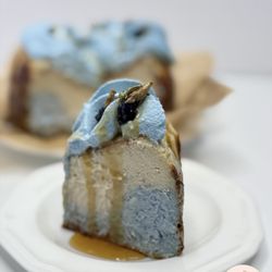 Burnt Honey Basque Banoffee Cheesecake-Butterfly pea-infused base, Basque cheesecake center, banana on top, & finished w/butterfly pea honey