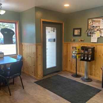 The Pizza Shop - a table and chairs in front of a window - Pizza Near Me - Merrill, Wisconsin The Pizza Shop - a table and chairs in front of a window - Pizza Near Me - Merrill, Wisconsin