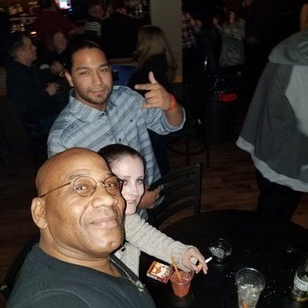 Jimmy G's Cigar Bar - a man and a woman sitting at a table - Lounges Near Me - Carson City, Nevada