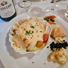 The best Coquilles St. Jacques. Delicate cheese sauce, and the fish cooked perfectly.