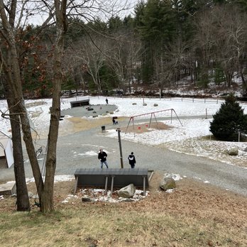 Silver Bell Farm - Looking down from the side of the main building.  Theres a swing set and the area I mentioned where kids can ride pedaled bike/cars. - Christmas Trees Near Me - Monson, Massachusetts