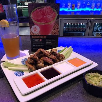 Dave & Buster's Euless - Grilled chicken wings with a selection of four sauces! Celery and guac (no chips?) on the side with a tall Blue Moon - Arcades Near Me - Euless, Texas Dave & Buster's Euless - Grilled chicken wings with a selection of four sauces! Celery and guac (no chips?) on the side with a tall Blue Moon - Arcades Near Me - Euless, Texas