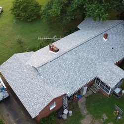 Double Helix Construction - Another happy home owner with a Lifetime Guaranteed Owens Corning Roof we did.
