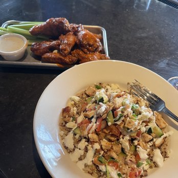 BJ's Restaurant & Brewhouse - Enlightened Mediterranean Chicken Pita Tacos and Lemon Pepper Bone-In Wings tossed in Buffalo sauce - Breweries Near Me - Goodyear, Arizona