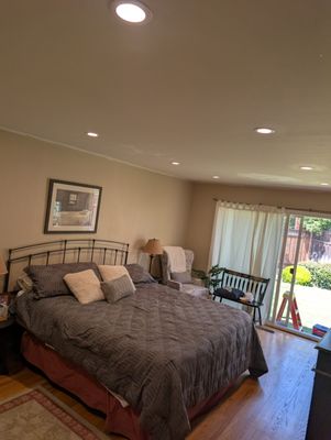 2025 Recessed Light Upgrade - This project showcases a truly professional lighting transformation, completed in just one day. We meticulously replaced an outdated fan light with multiple, modern recessed lights, bringing a vibrant new feel to the space. Our process began with the precise removal of the old fixture, followed by exact measurements and careful cutting for each new light's placement. Running the new wiring was done with impeccable neatness, ensuring all wires were perfectly bundled for a clean, organized installation. Beyond the technical work, our commitment to an exceptional client experience meant we thoroughly covered and protected all furniture and belongings, ensuring a dust-free environment. After completing the work, we meticulously cleaned up all the coverings and returned the room to its pristine previous condition, as if we were never there. We then expertly patched the hole from the previous light and painted the area for a seamless finish. Our clients were absolutely thrilled with the dramatic difference the new lights made.