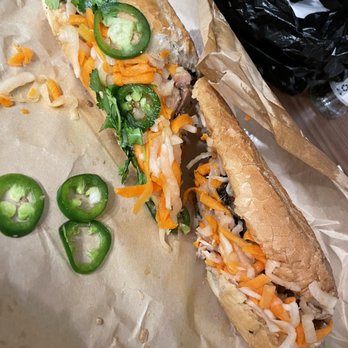 Saigon Hustle | Garden Oaks - Chicken Banh Mi - to go cut in 1/2 - Vietnamese Near Me - Houston, Texas Saigon Hustle | Garden Oaks - Chicken Banh Mi - to go cut in 1/2 - Vietnamese Near Me - Houston, Texas