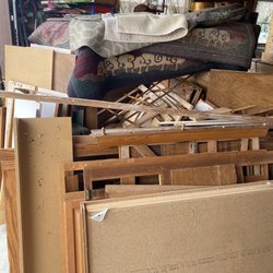 ijunkHaul - Pile of junk in garage before haul away