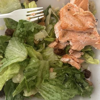 P-Dubs Brew Pub - A salad with chopped lettuce, pieces of cooked salmon, croutons, and shredded cheese in a foam takeout container. - Pubs Near Me - Tehachapi, California